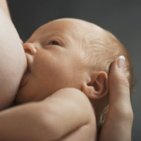 Mother and baby breastfeeding