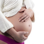 Pregnant woman holding belly